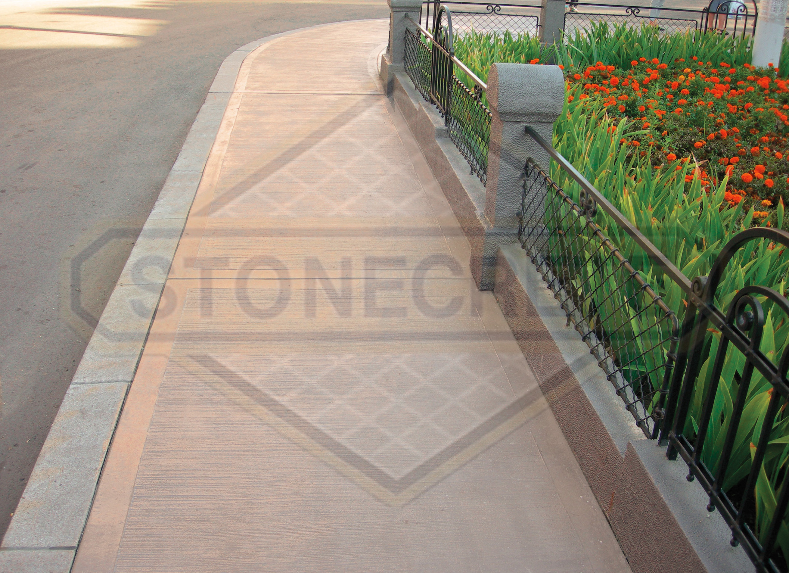 STONECRETE COMBED FLOORING, FOR NON-SKIDDING QUALITIES WITHOUT HARSH TEXTURE. IT IS CONSTRUCTED ON FRESH CONCRETE WITH STONECRETE COLOUR HARDENERS AND GIVEN TEXTURE WITH METALLIC TOOLS